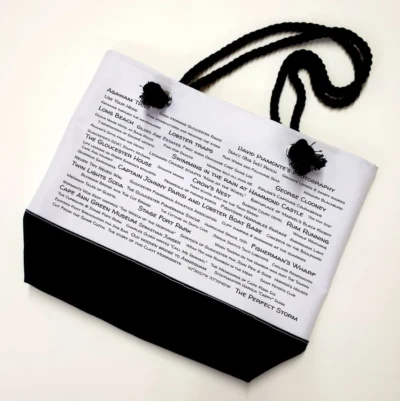 A bag with black cord and white paper.