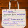 The back half of a canvas tote bag describing fun at the beach!