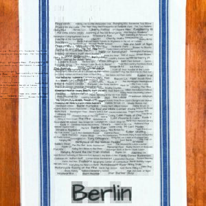 A blue striped towel with trivia about Berlin, Connecticut