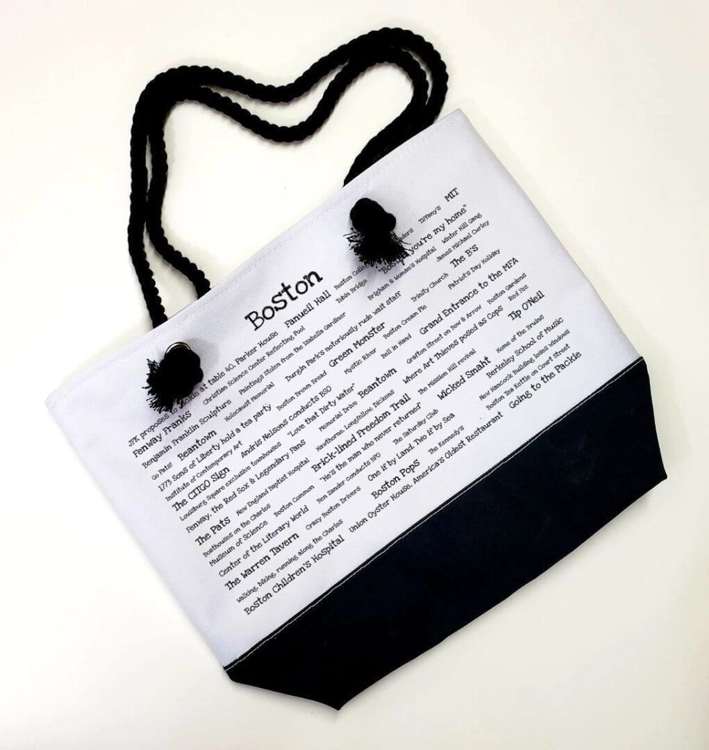 A bag with a black handle and some white paper