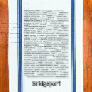 A blue striped towel with trivia about Bridgeport, Connecticut