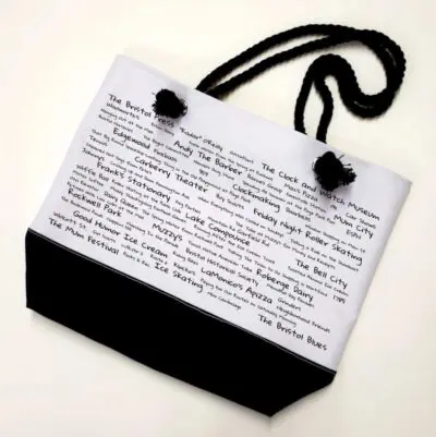 A black and white bag with writing on it