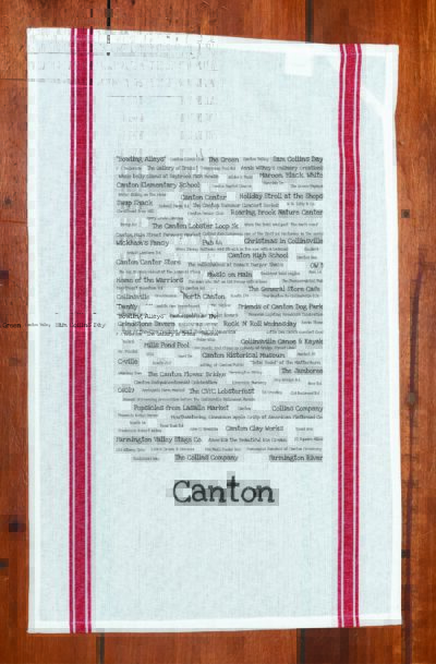 A red striped towel with trivia about Canton, Connecticut