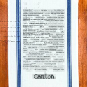 A blue striped towel with trivia about Canton, Connecticut