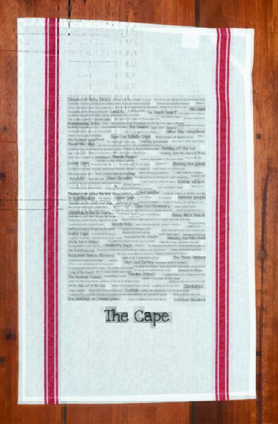 A red striped towel with trivia about Cape Cod in Massachusetts