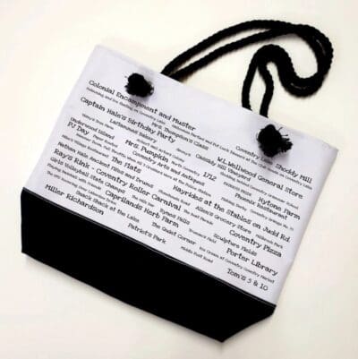 A black and white bag with words on it