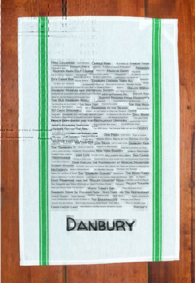 A green striped towel with trivia about Danbury, Connecticut