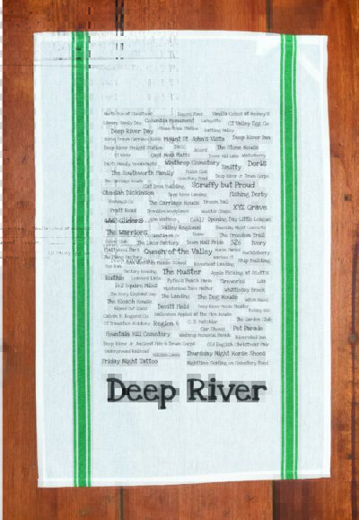 A green striped towel with trivia about the town of Deep River, Connecticut