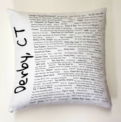 A pillow with the words " derby ct ".