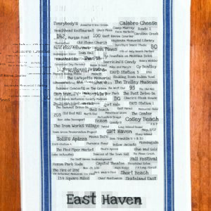 A blue striped towel with trivia about the town of East Haven, Connecticut