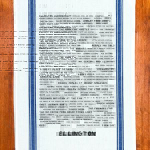 A blue striped towel with trivia about the town of Ellington, Connecticut