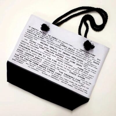 A black and white bag with writing on it