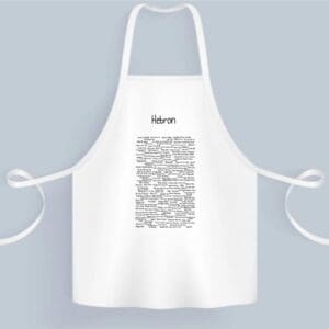 A white apron with a bunch of words written on it