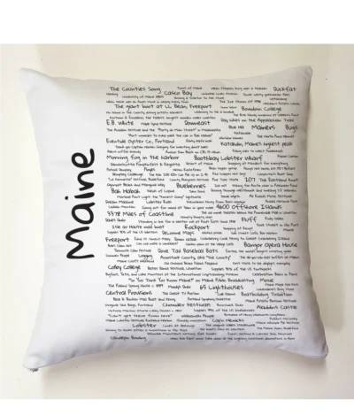 A pillow with the word maine written on it.