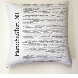 A pillow with the words manchester, nh written on it.