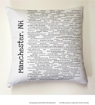 A pillow with the words manchester, nh written on it.