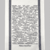 A white towel with black writing on it.