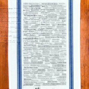 A blue striped towel with trivia about the town of Milford, Connecticut