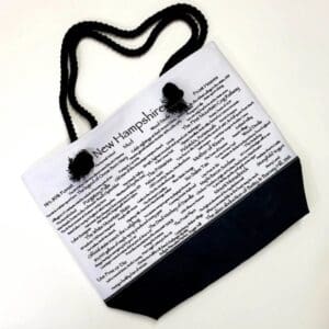 A bag with a black handle and some white paper