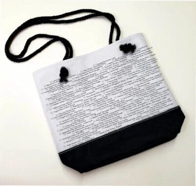 A white and black bag with a string on it