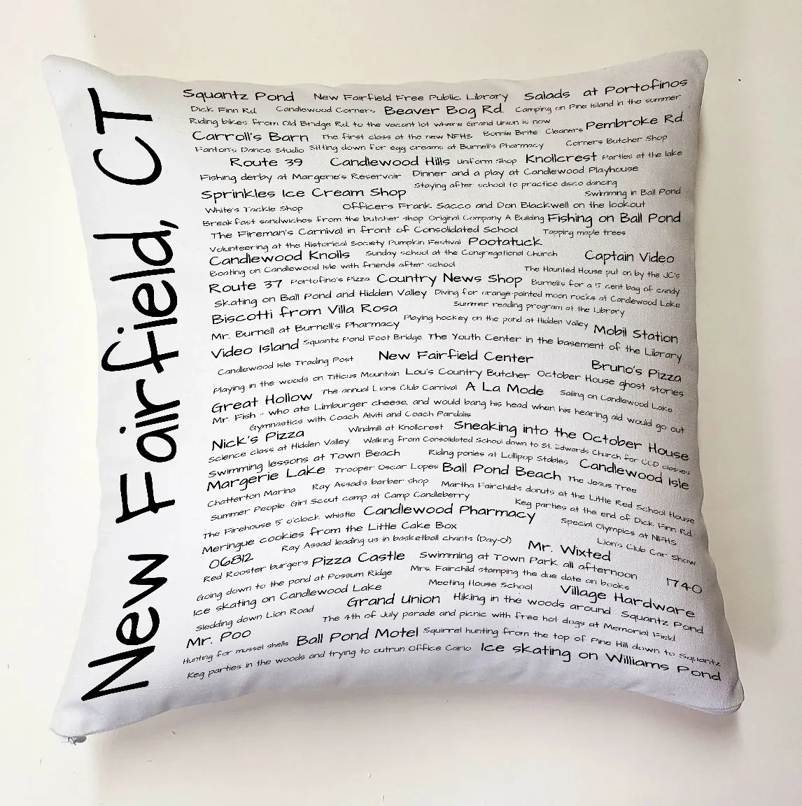 A pillow with the words new fairfield ct written on it.