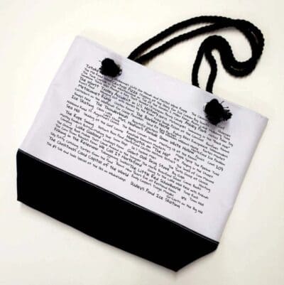 A black and white bag with a picture of the word " poetry ".