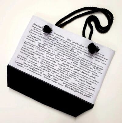 A bag with black cord and white paper.