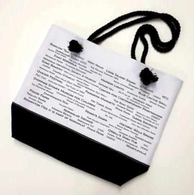 A bag with black cord and white paper.