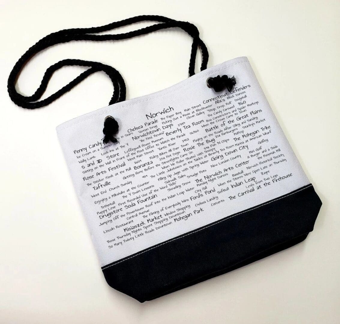 A bag with black string and white paper.