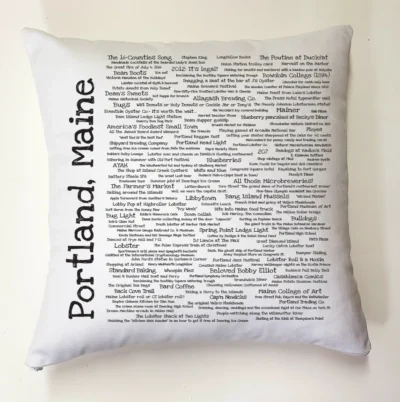 A pillow with the words portland, maine written on it.