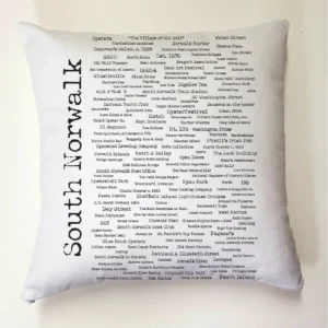 A white pillow with many words written on it.