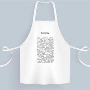 A white apron with a black and white image of the word " karma ".