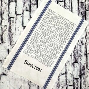 A white towel with the name shelton written on it.