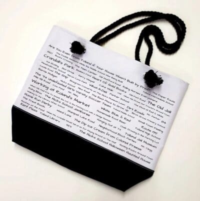 A bag with black cord and white paper.