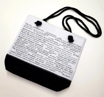 A black and white bag with words on it