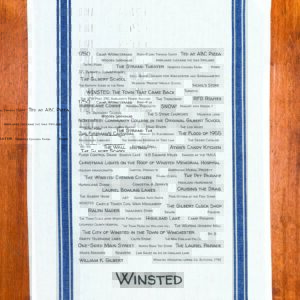 A blue striped towel with trivia about Winsted, Connecticut