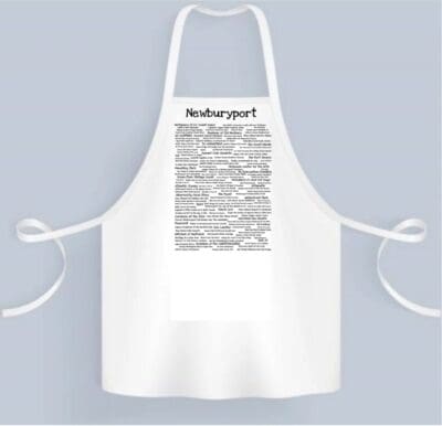 A white apron with the name of a city in black lettering.