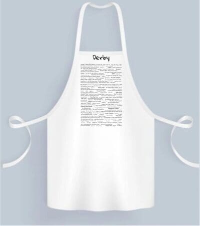 A white apron with a black and white design.