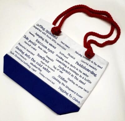 A blue and white bag with red string