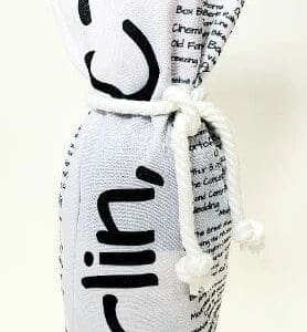 A white bottle with black writing on it