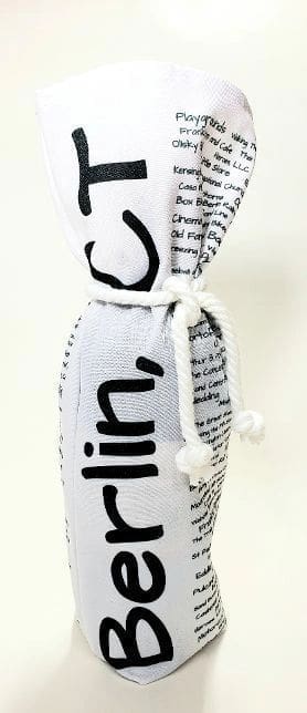 A white bottle with black writing on it