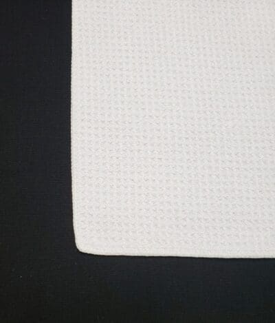 A white sheet of paper on top of black surface.