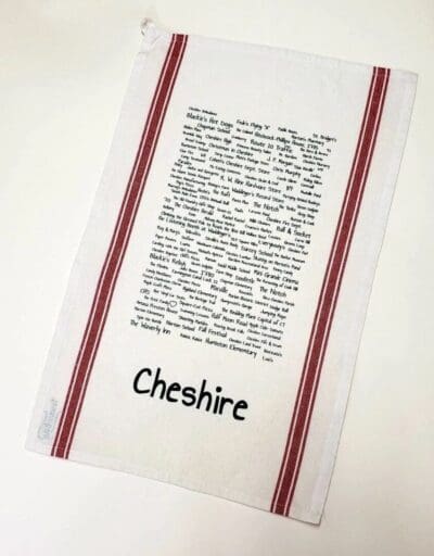 A tea towel with the name of cheshire written on it.