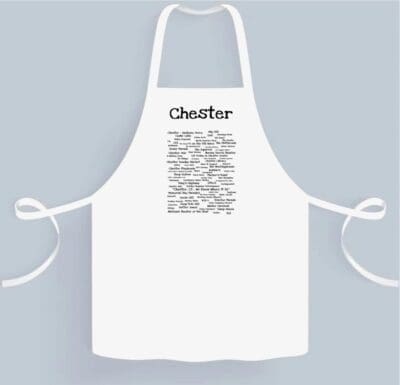 A white apron with the name cheviker written on it.