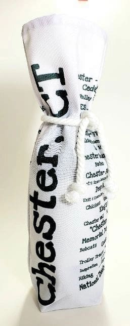 A bottle of wine in a white bag