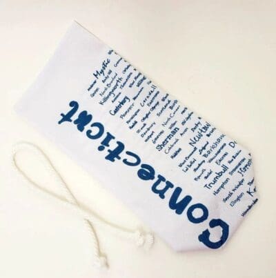 A white bag with blue writing on it.