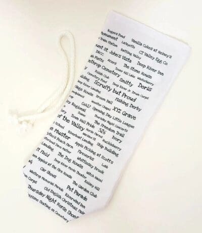 A white bookmark with black text on it.