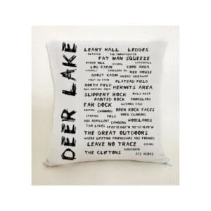 A pillow with the words deer lake written on it.