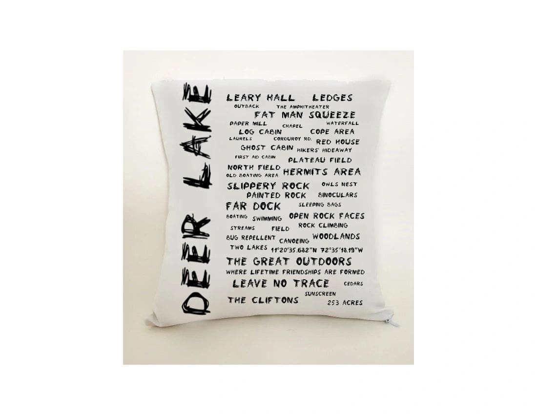 A pillow with the words deer lake written on it.