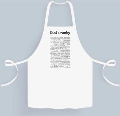 A white apron with the words " best breader ".